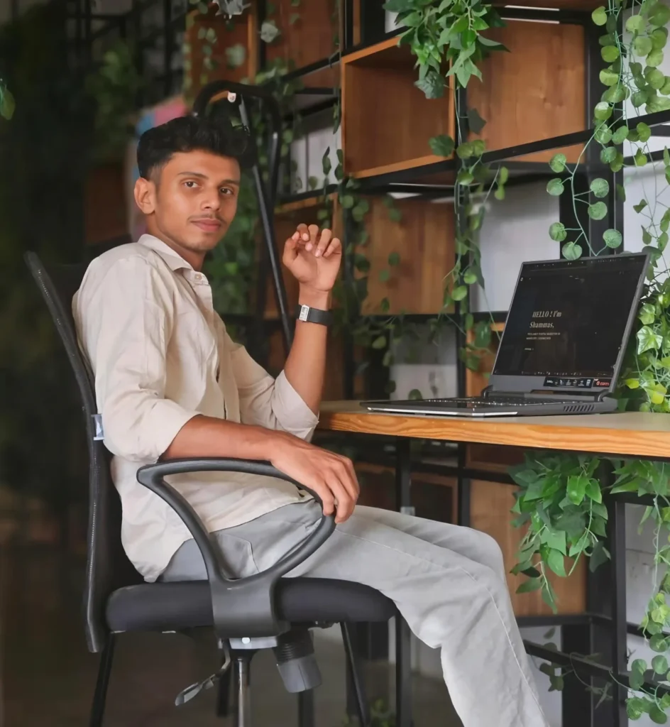 Freelance Digital Marketing Analyst in Mangalore working on a laptop in a modern workspace, focusing on content strategy and social media marketing.